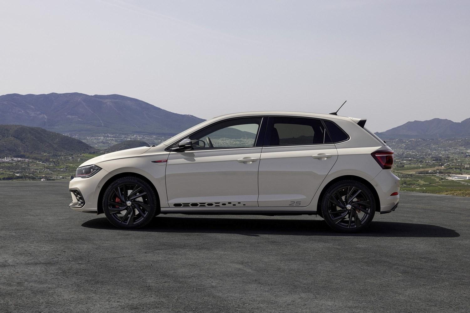 Side view of the new Volkswagen Polo in white, parked with mountain views behind