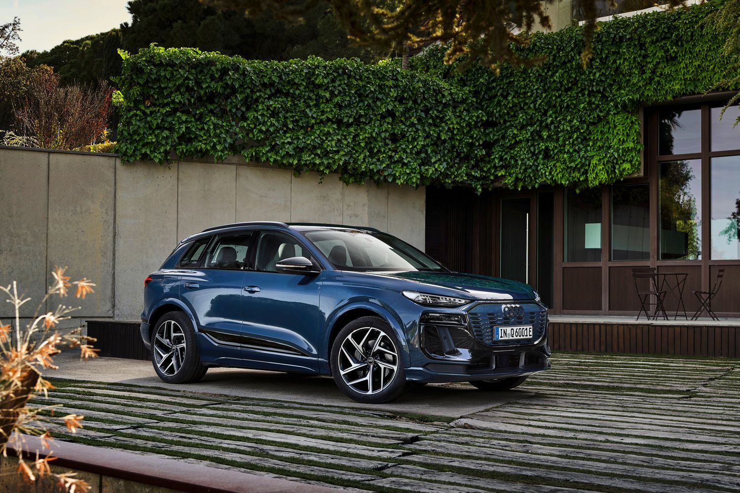 The all-new Audi Q6 e-tron parked outside house
