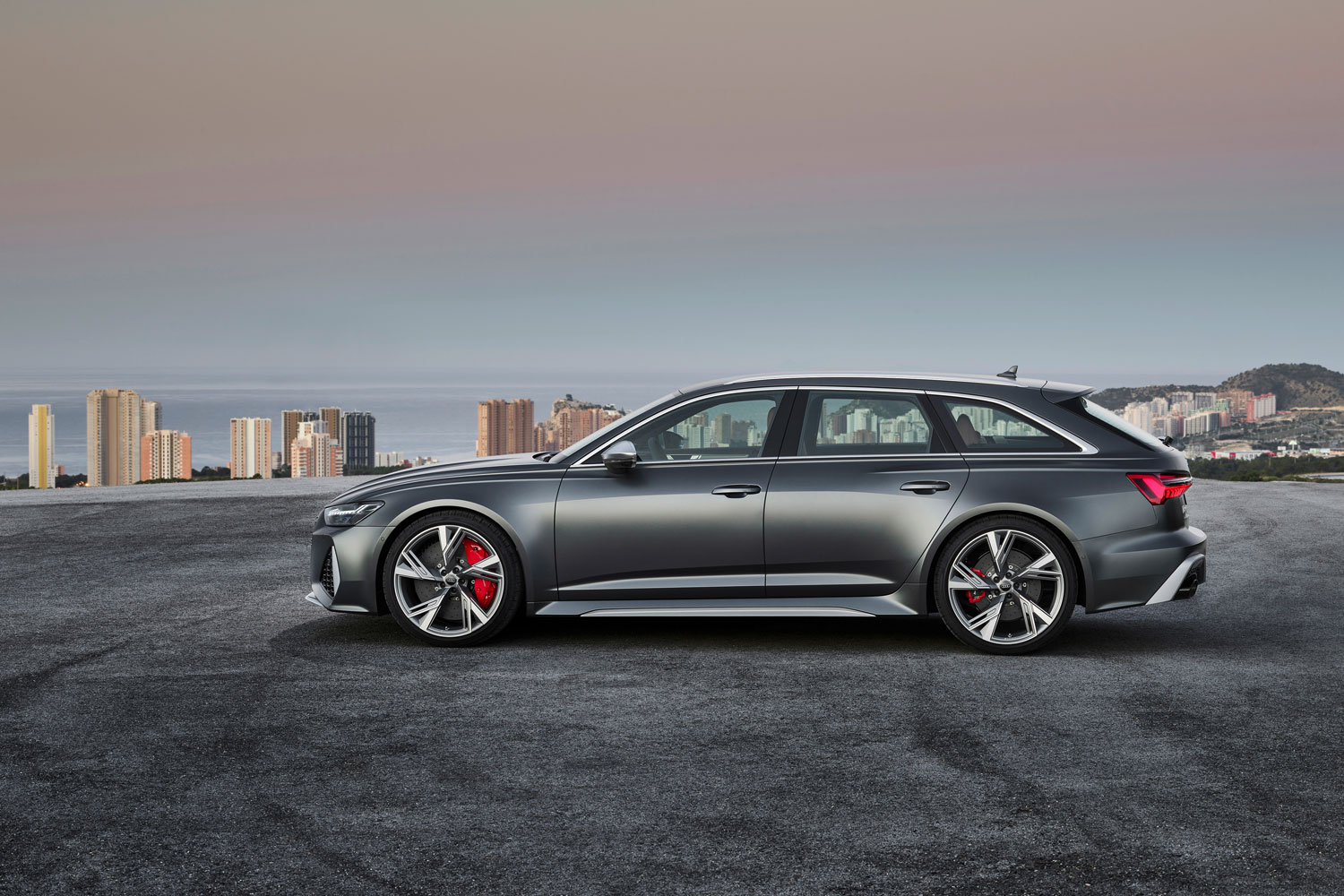 New Audi RS6 Avant in metallic black side view of vehicle parked