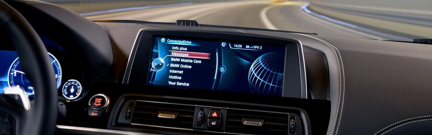 Close-up of a BMW infotainment system showing BMW ConnectedDrive open with Messages selected