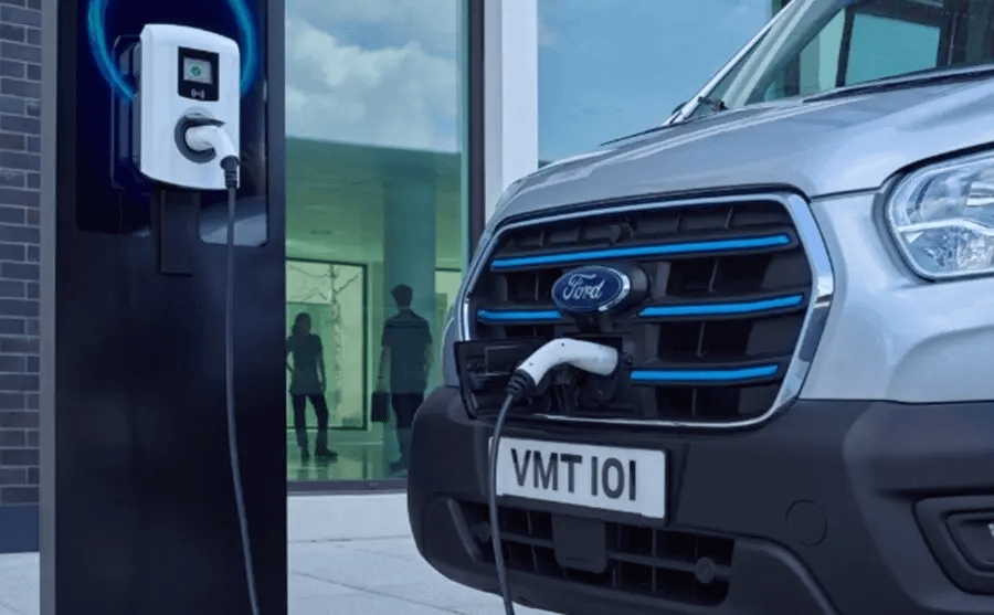 Ford Electric Vehicle on charge with charging plug in front of the vehicle