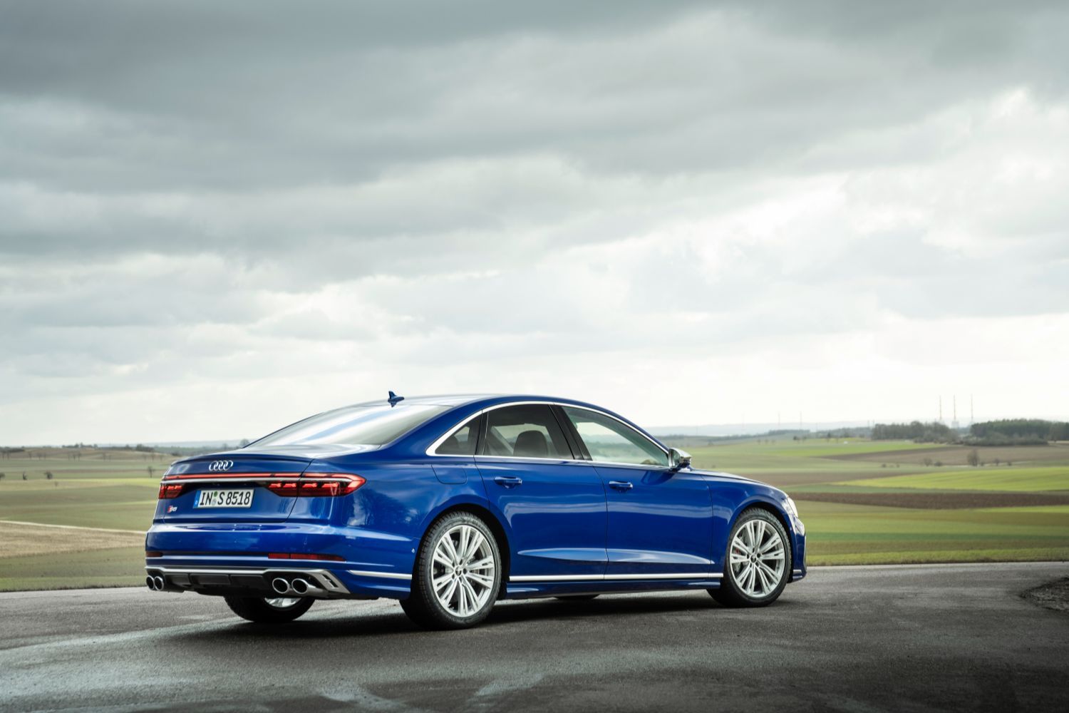 New Audi S8 in blue parked showcasing alloys and trim