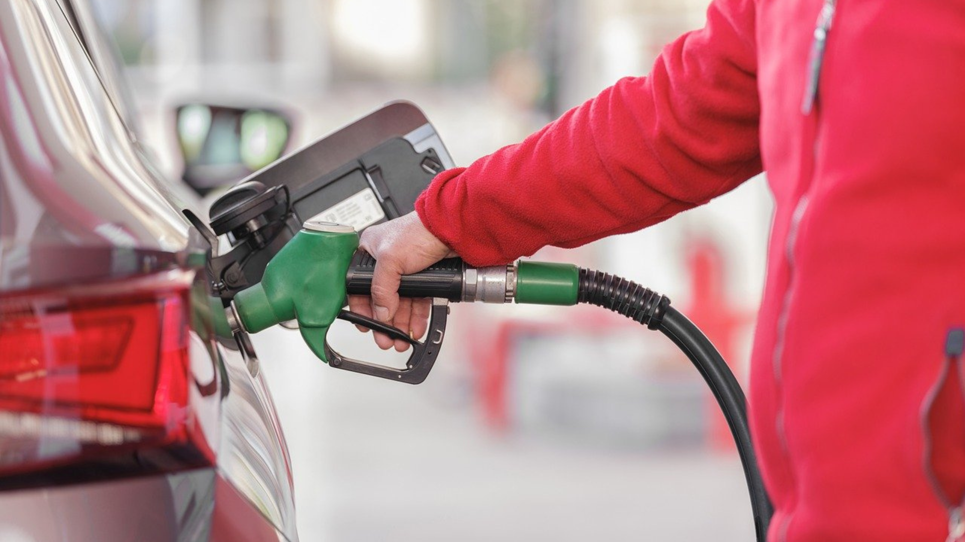 Person Fueling Car