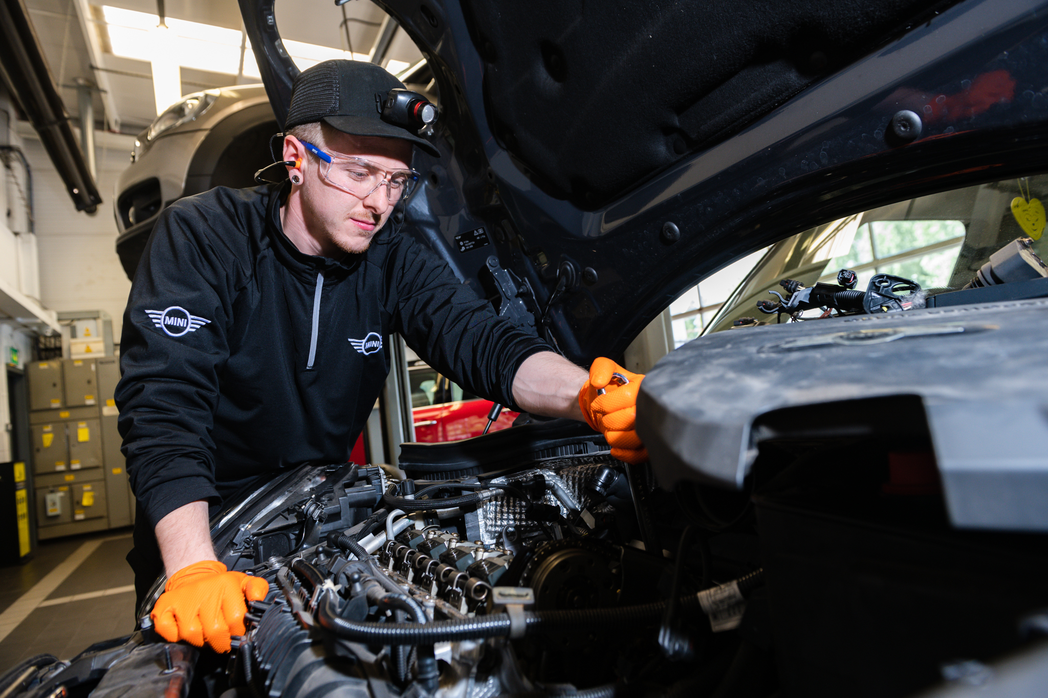 MINI Repair Specialist inspects engine of MINI Countryman at the MINI Repair Centre at Bavarian MINI