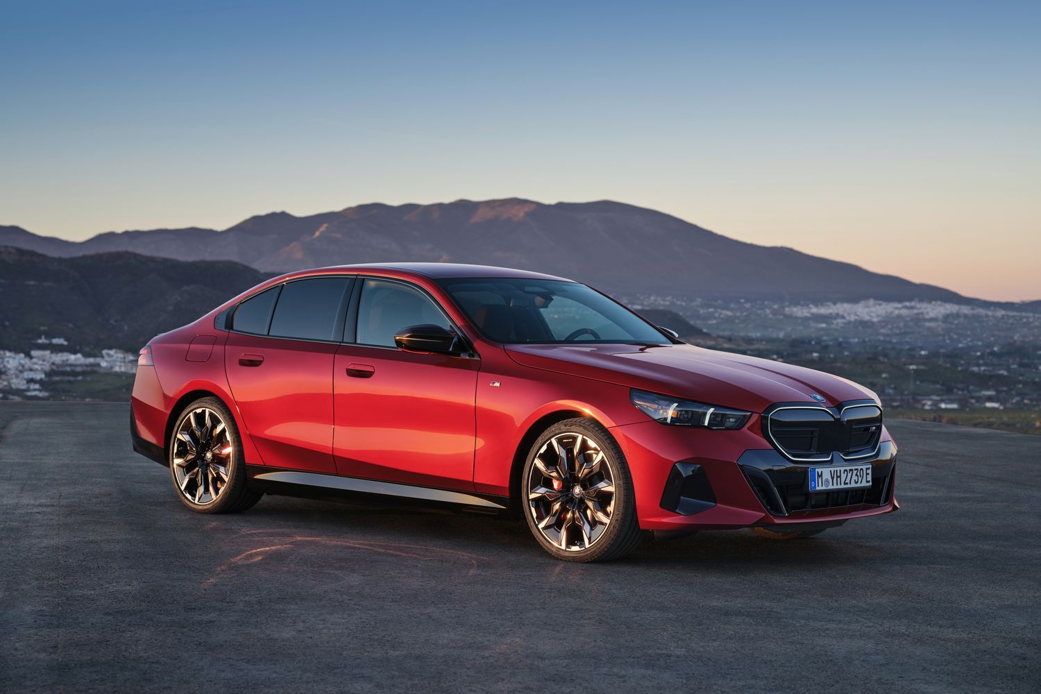 New BMW 5 Series Saloon in red, front view of vehicle parked