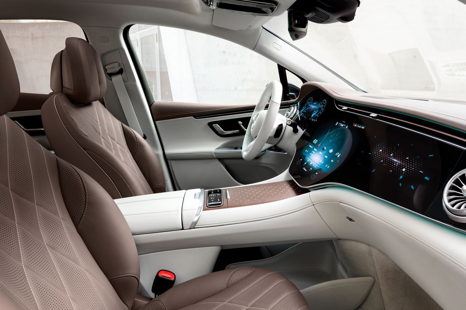 EQE SUV brown interior seats, white steering wheel and infotainment system.