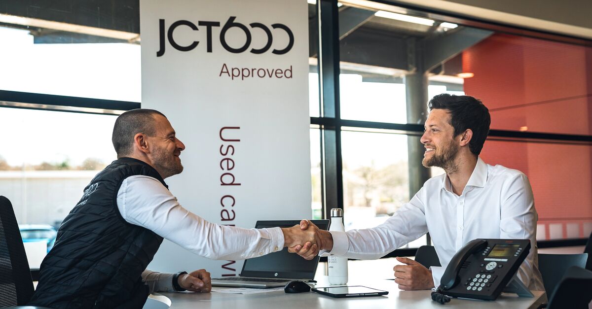 JCT600 colleague shaking hands with customer