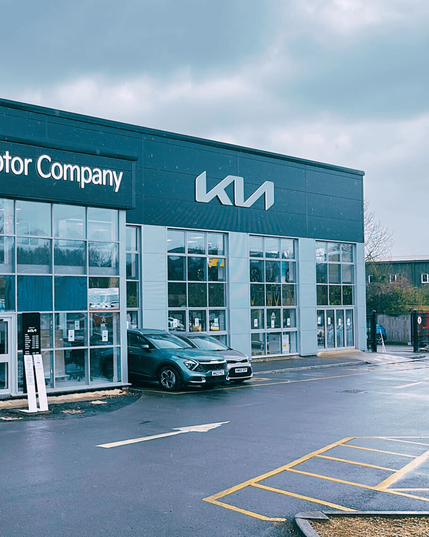 New illuminated Kia signs on the Chippenham Motor Company building