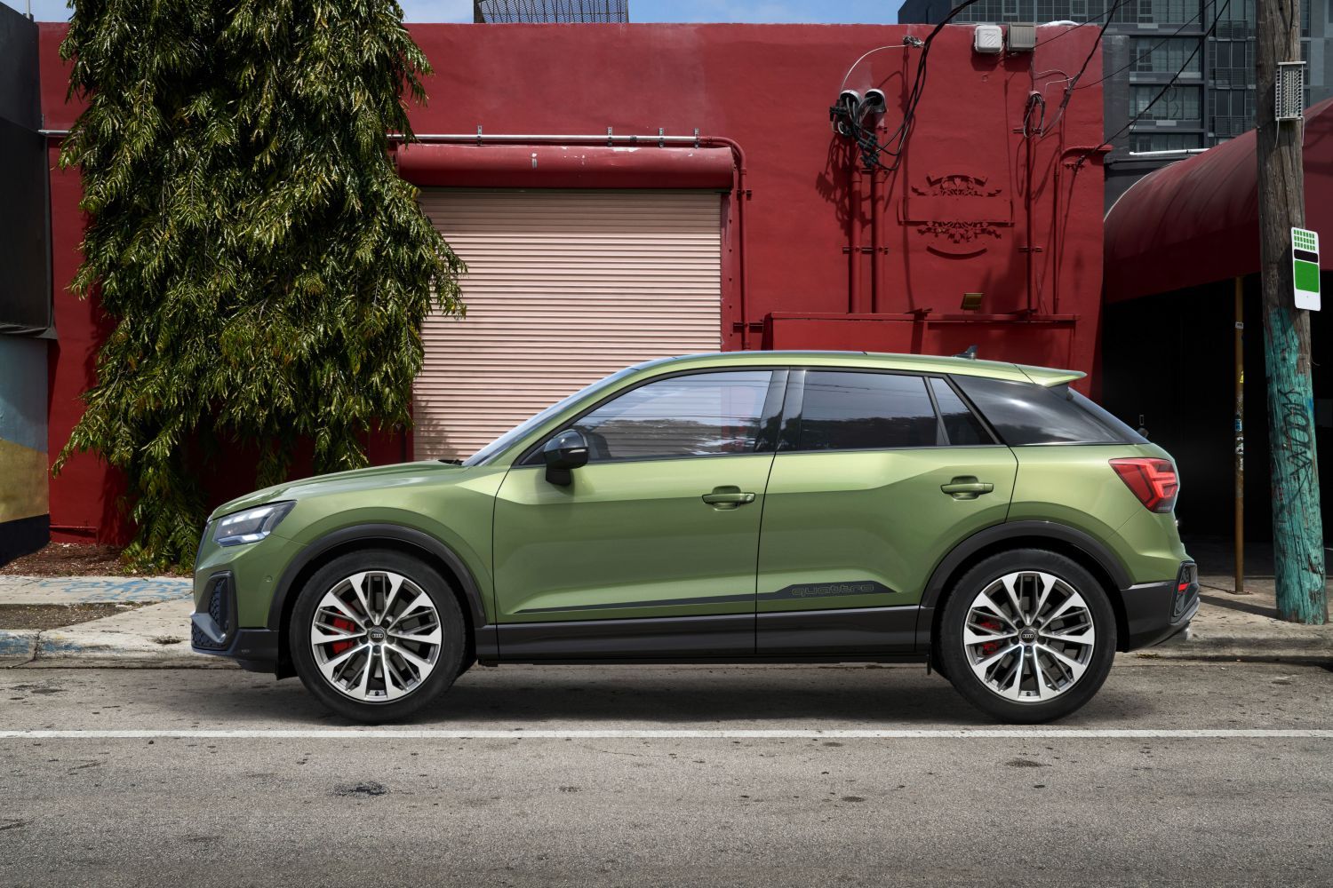 New Audi SQ2 in green side view of vehicle parked
