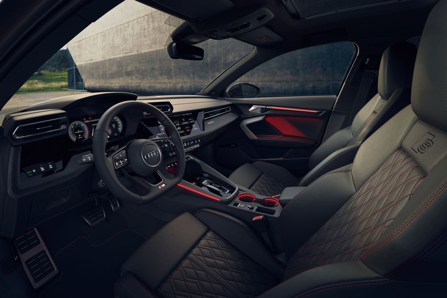 The newly updated Audi S3 Sportback's black interior with red LED lights and driver display.