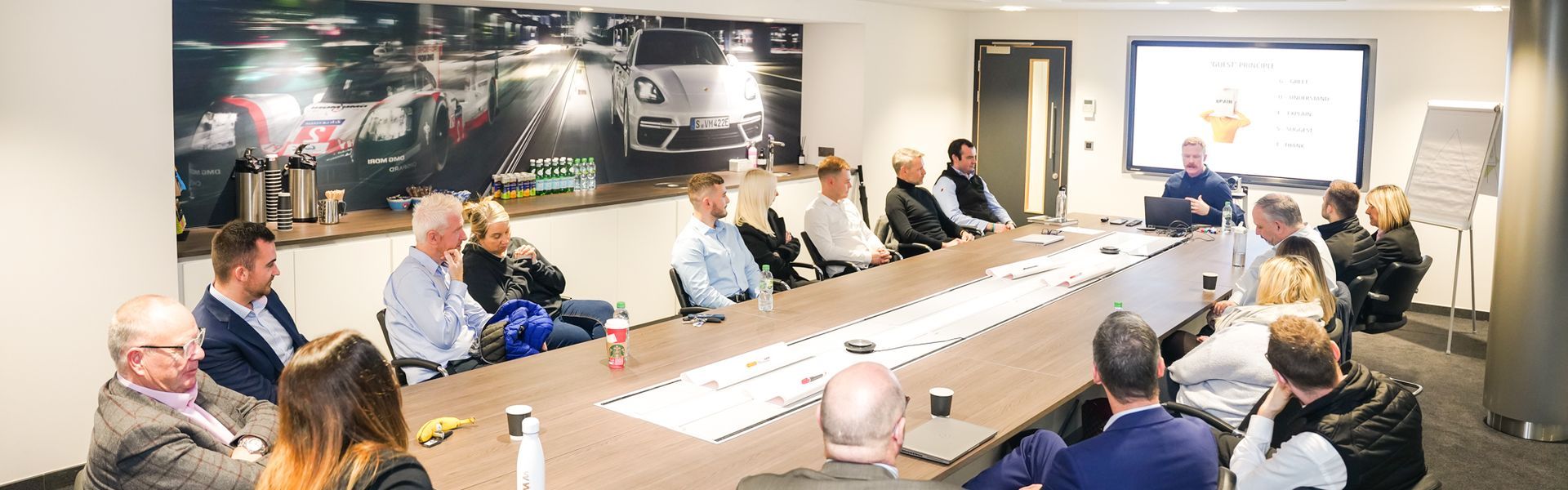 MindWise NI conducting Mental Health Training at Porsche Centre Belfast to a large group of team members from across Agnew Group