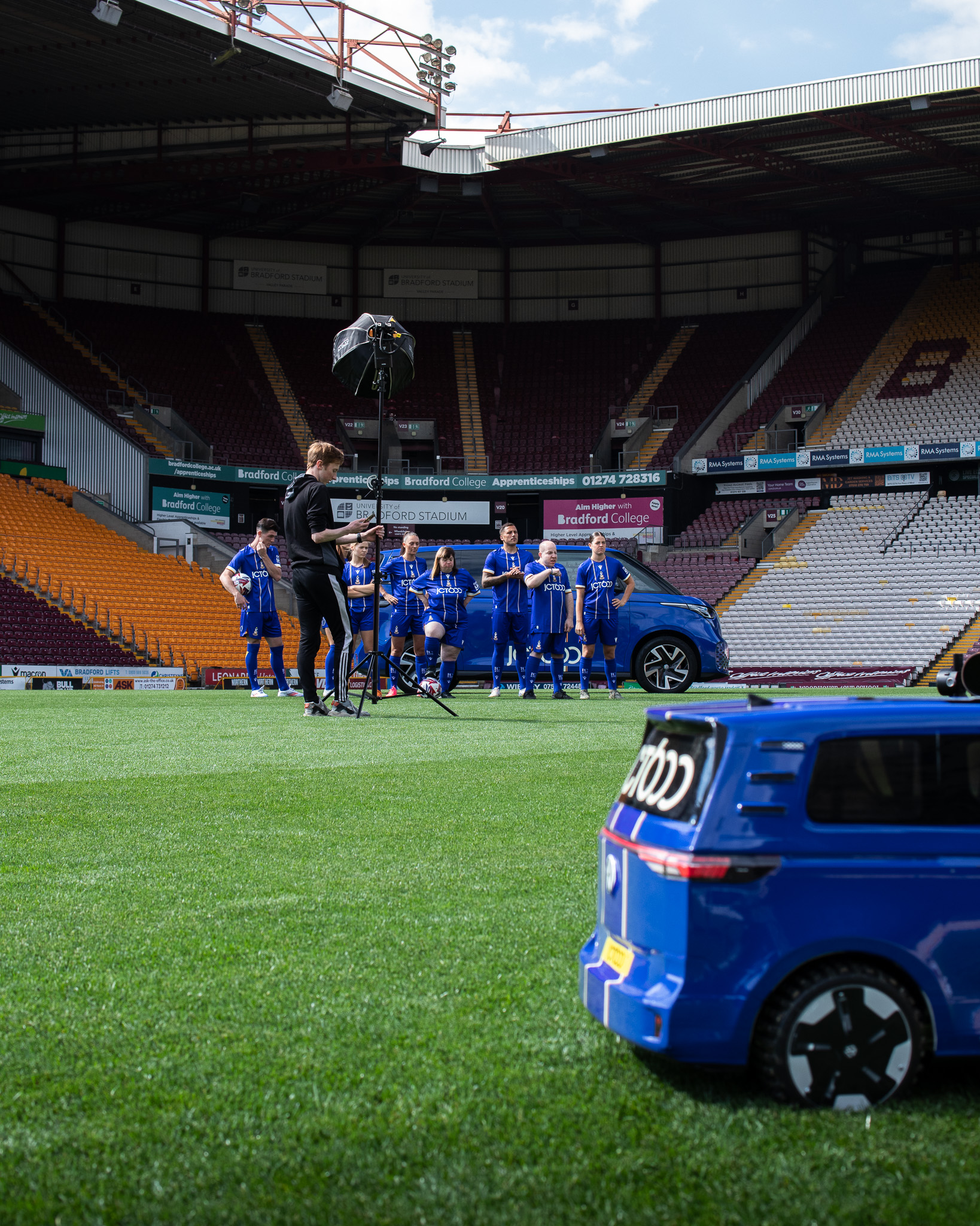 Bradford City Third Kit Behind the Scenes players stood in front of Volkswagen ID. Buzz