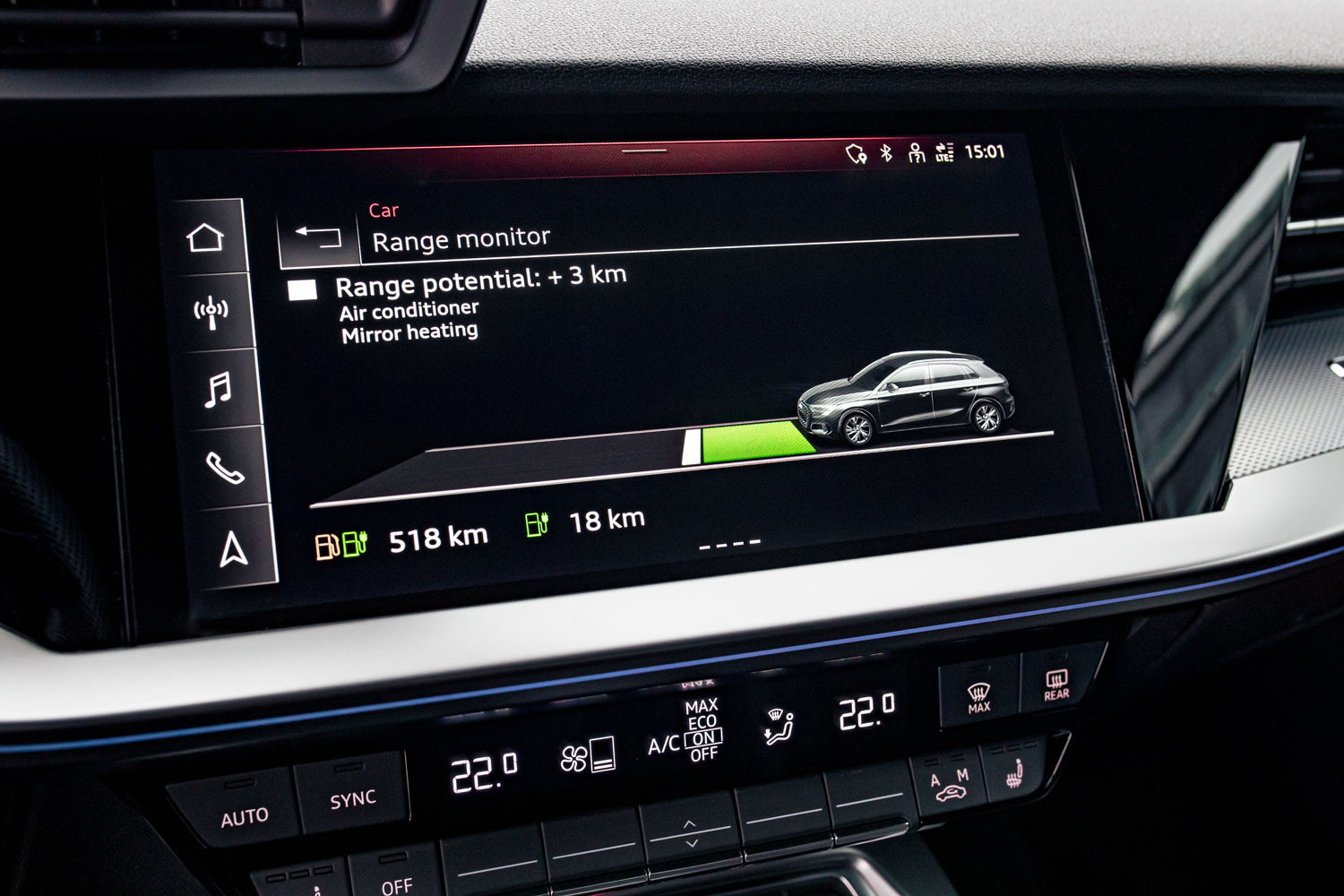 Close-up of a vehicles infotainment system with range monitor open so the driver can see how much range potential their vehicle has left