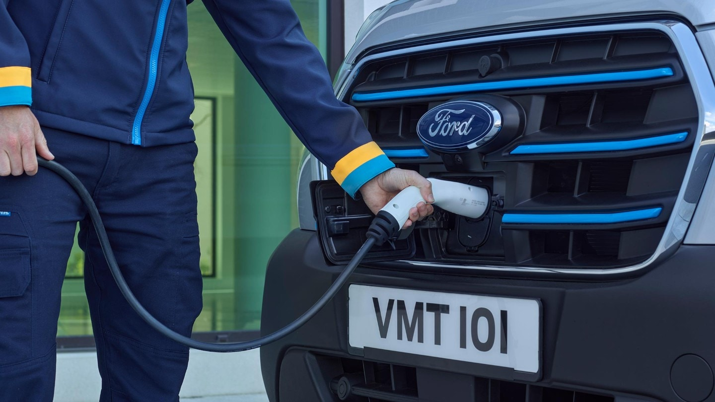 Silver Ford E Transit on charge