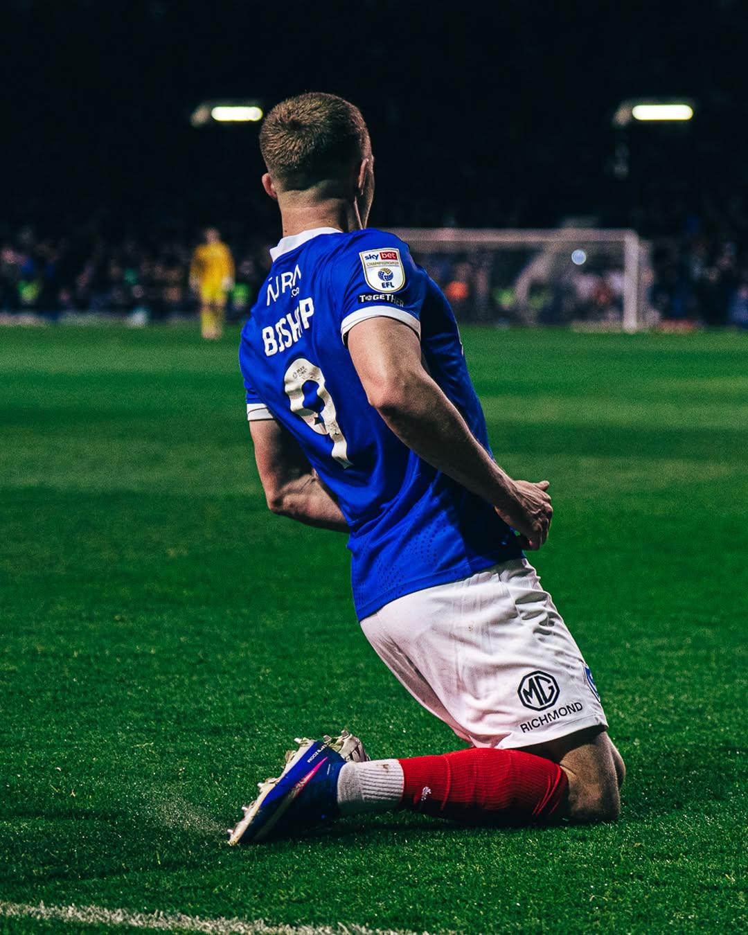 Colby Bishop celebrating a goal against Ipswich at Fratton Park