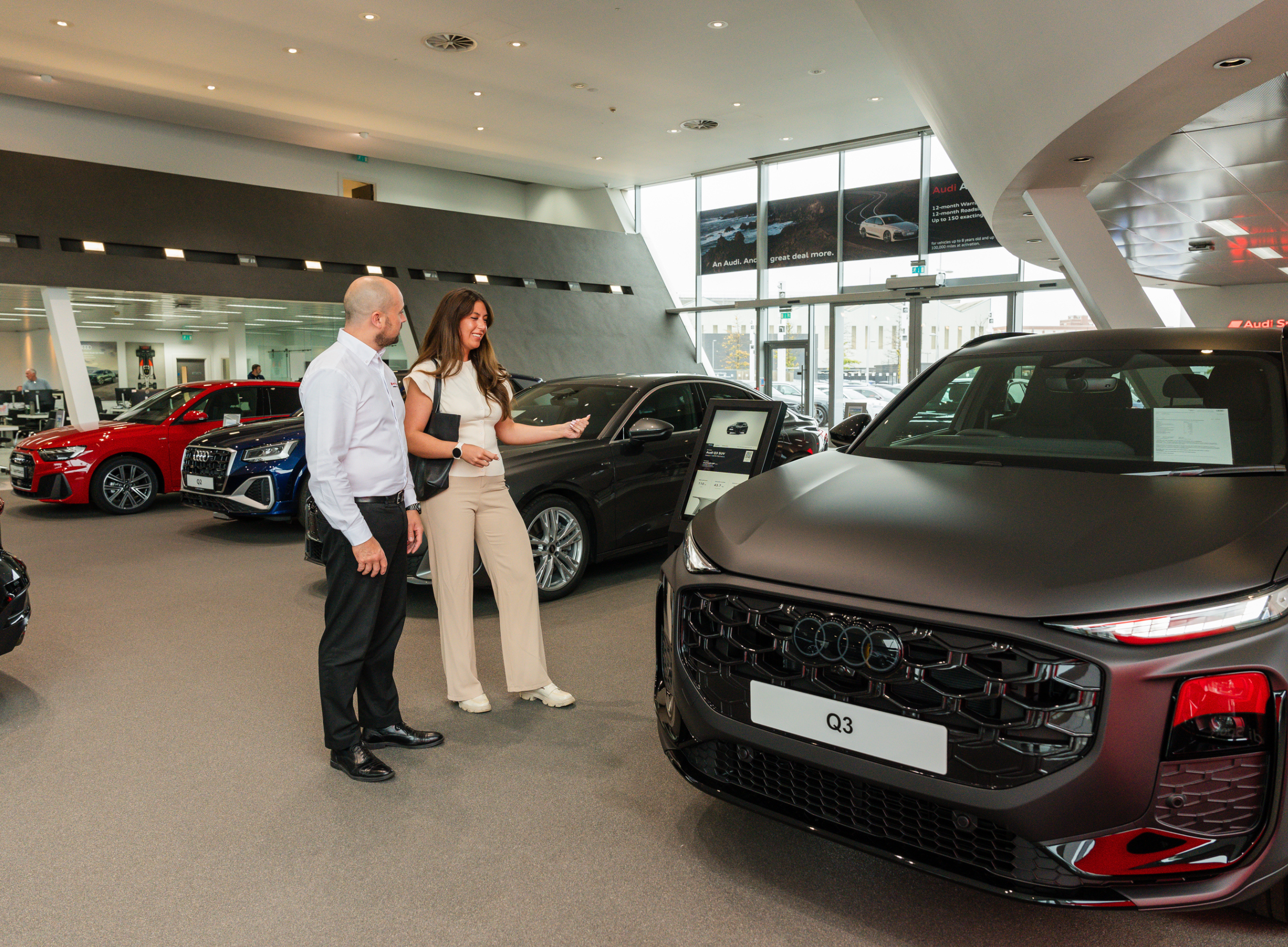 woman enquiring about an audi q3 in Belfast Audi