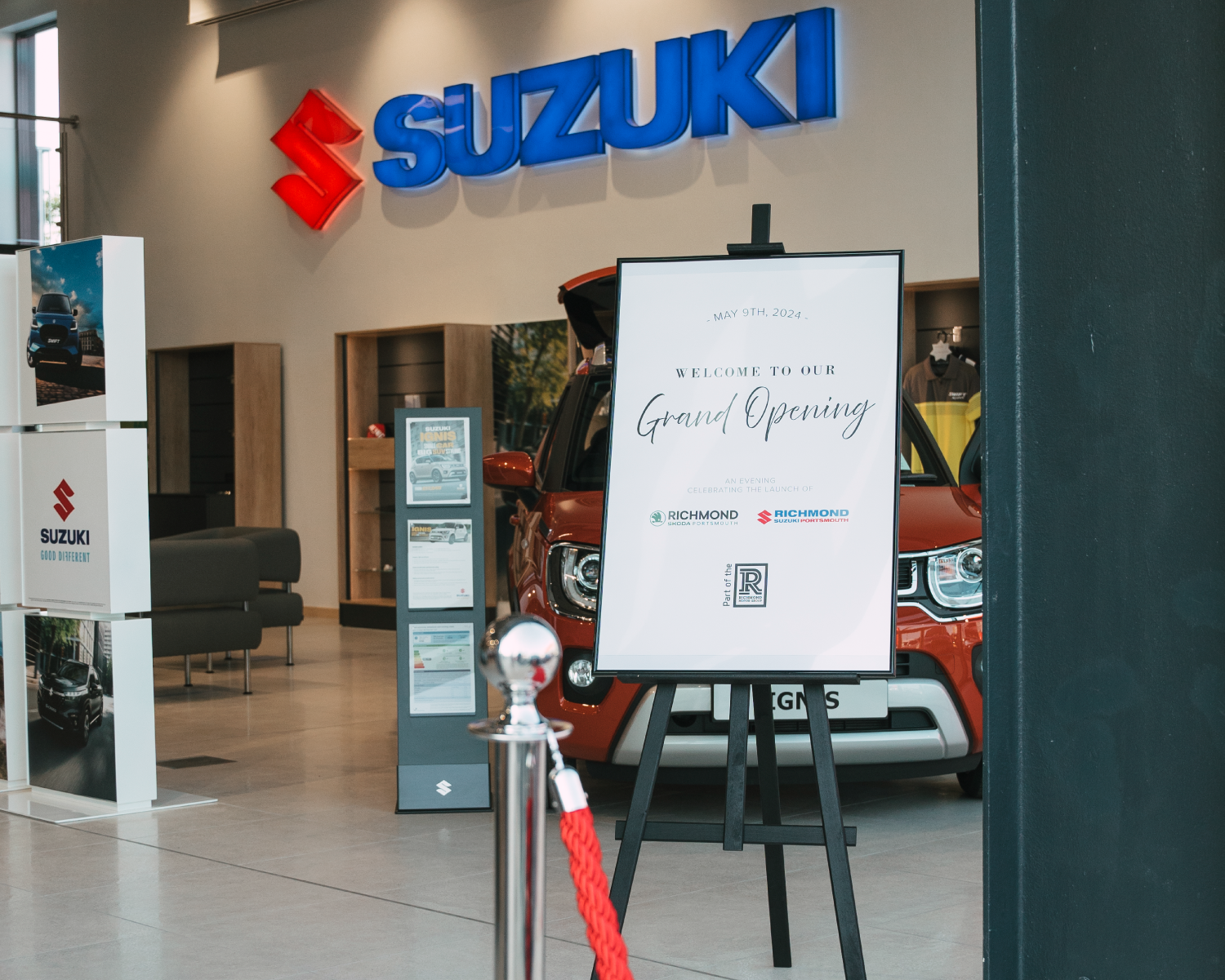 Welcome to the new Grand Opening Easel at the new Richmond Suzuki Showroom door, with Suzuki branding in the background