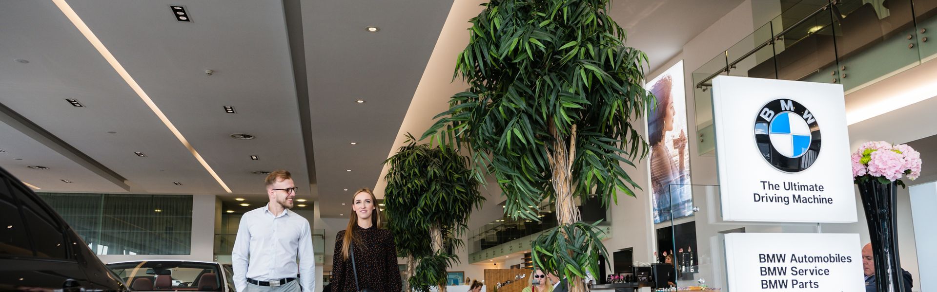 Customers walk through the Bavarian BMW Belfast showroom, on the left; the different models available and on the right; the BMW lounge