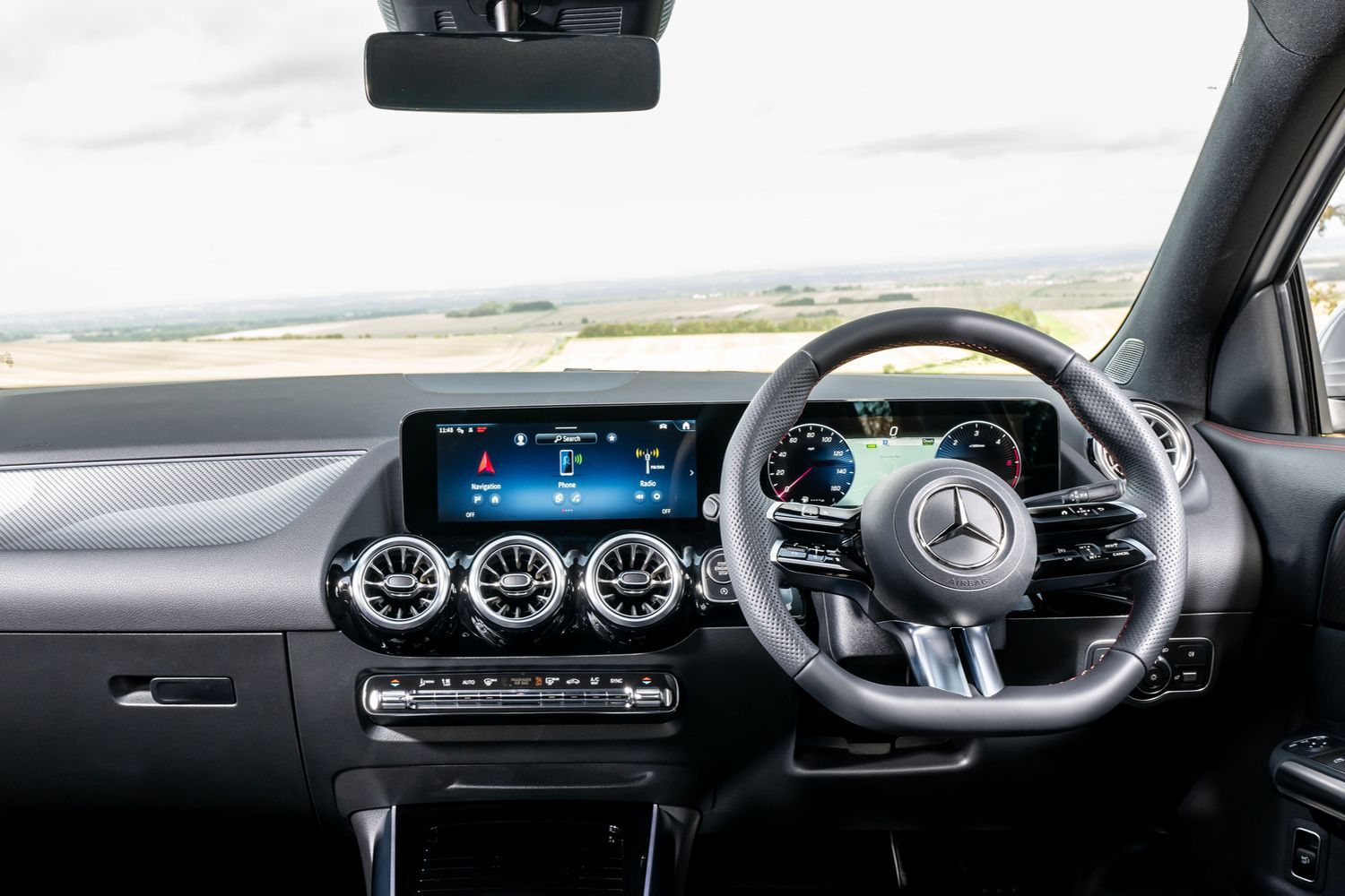 The Mercedes-Benz GLA steering wheel and infotainment system.