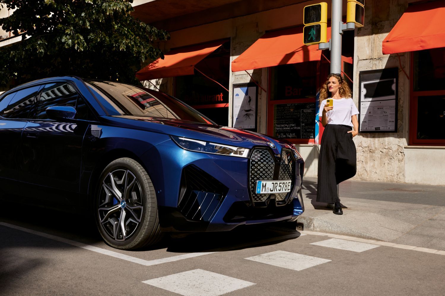 Woman checks her app for BMW Proactive Care