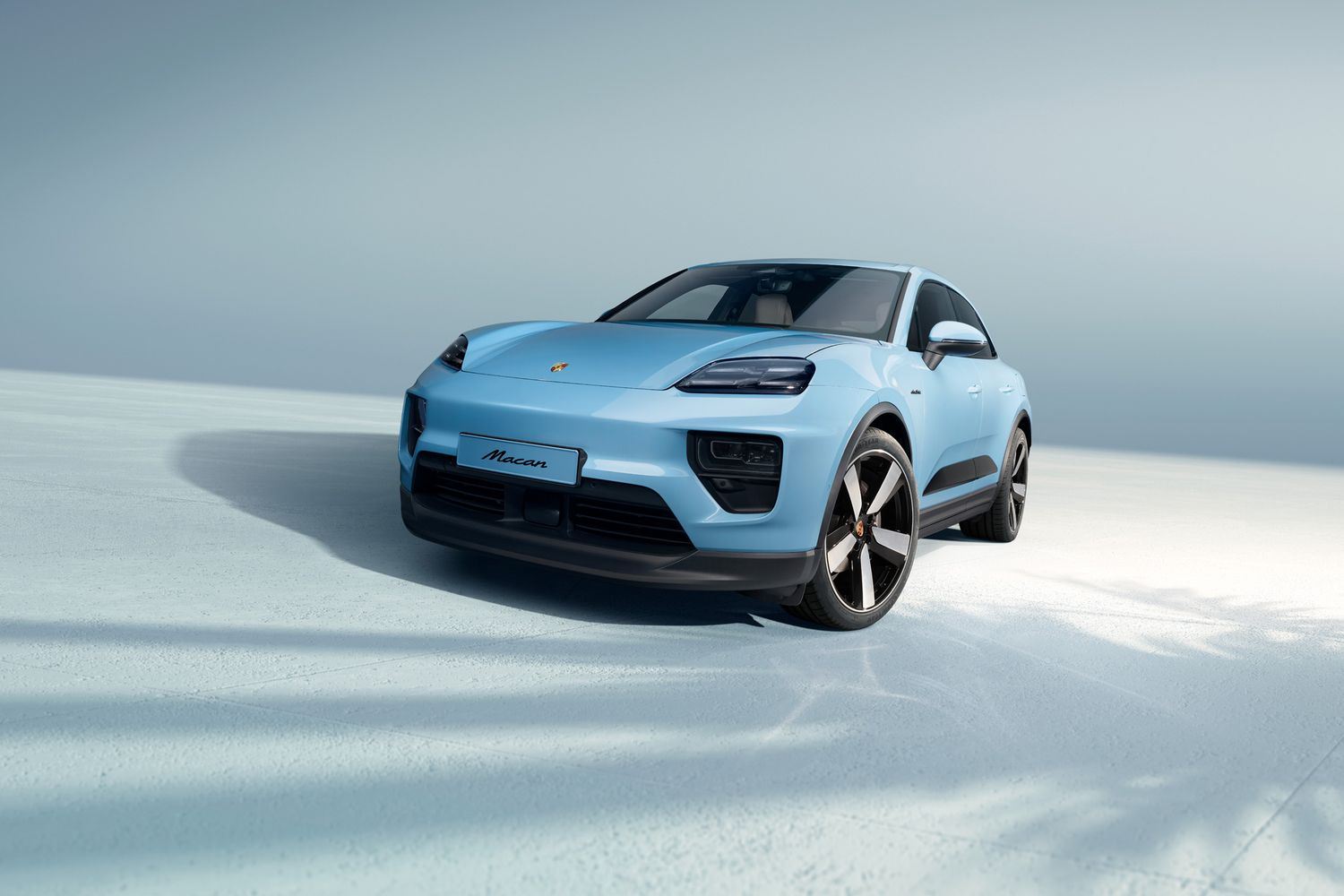 Exterior view of the new all electric Porsche Macan in light blue