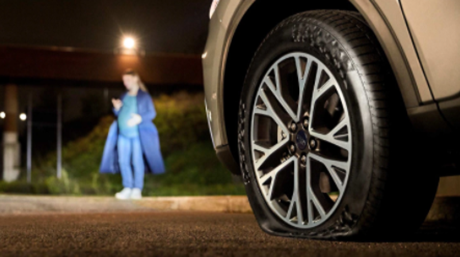 Close up of car with flat tyre