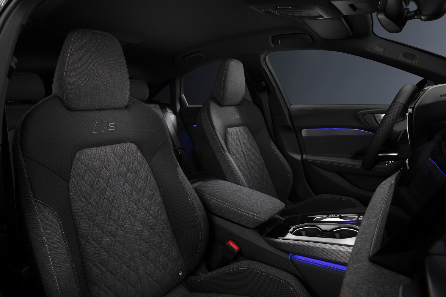 Black interior of the new Audi A5 Saloon featuring blue lights.