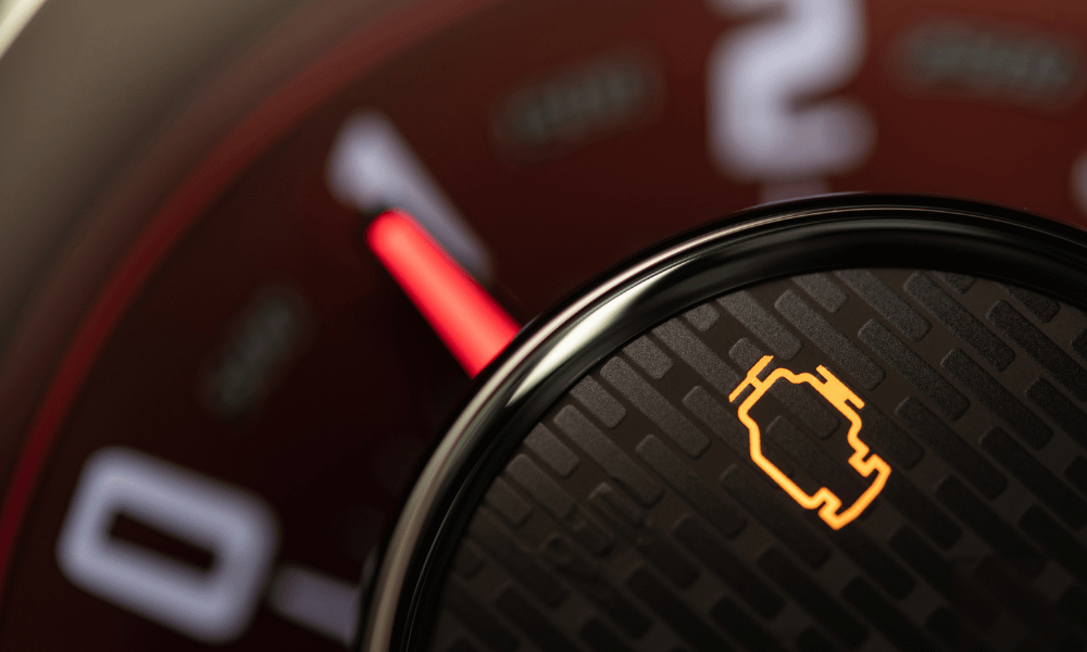 Car dashboard with engine management light