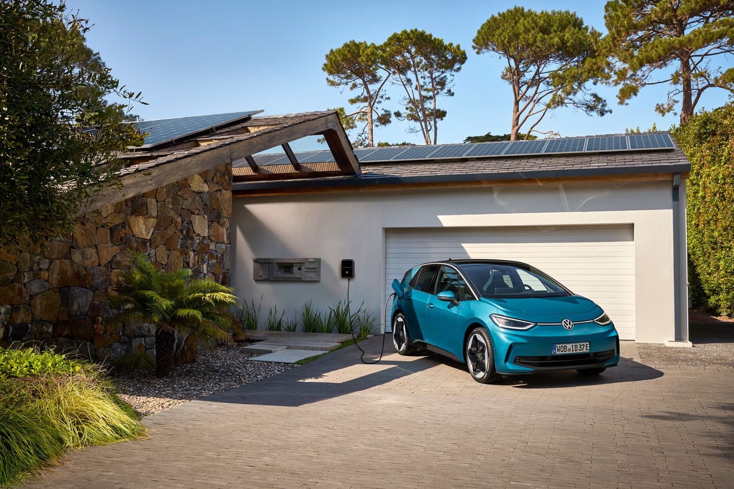 Volkswagen ID.3 parked at home, on electric charging point.