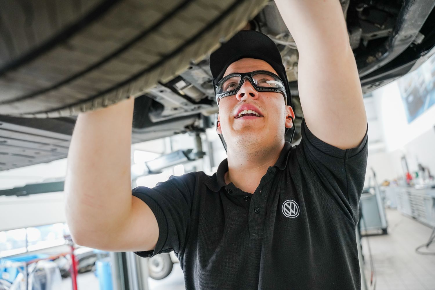Volkswagen Commercials Technician inspects the wheel of a Volkswagen Caddy at the Volkswagen Approved Repair Centre, Agnew Van Centre, Mallusk, Northern Ireland.