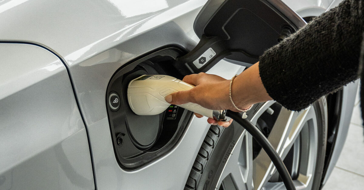 Electric Audi being plugged in to charge