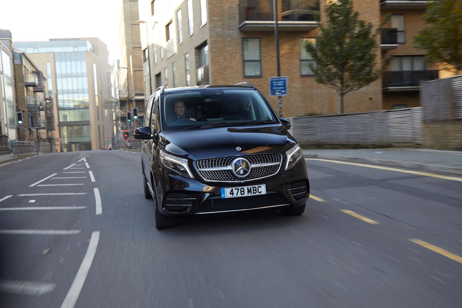Front view of a black Mercedes-Benz V-Class driving.