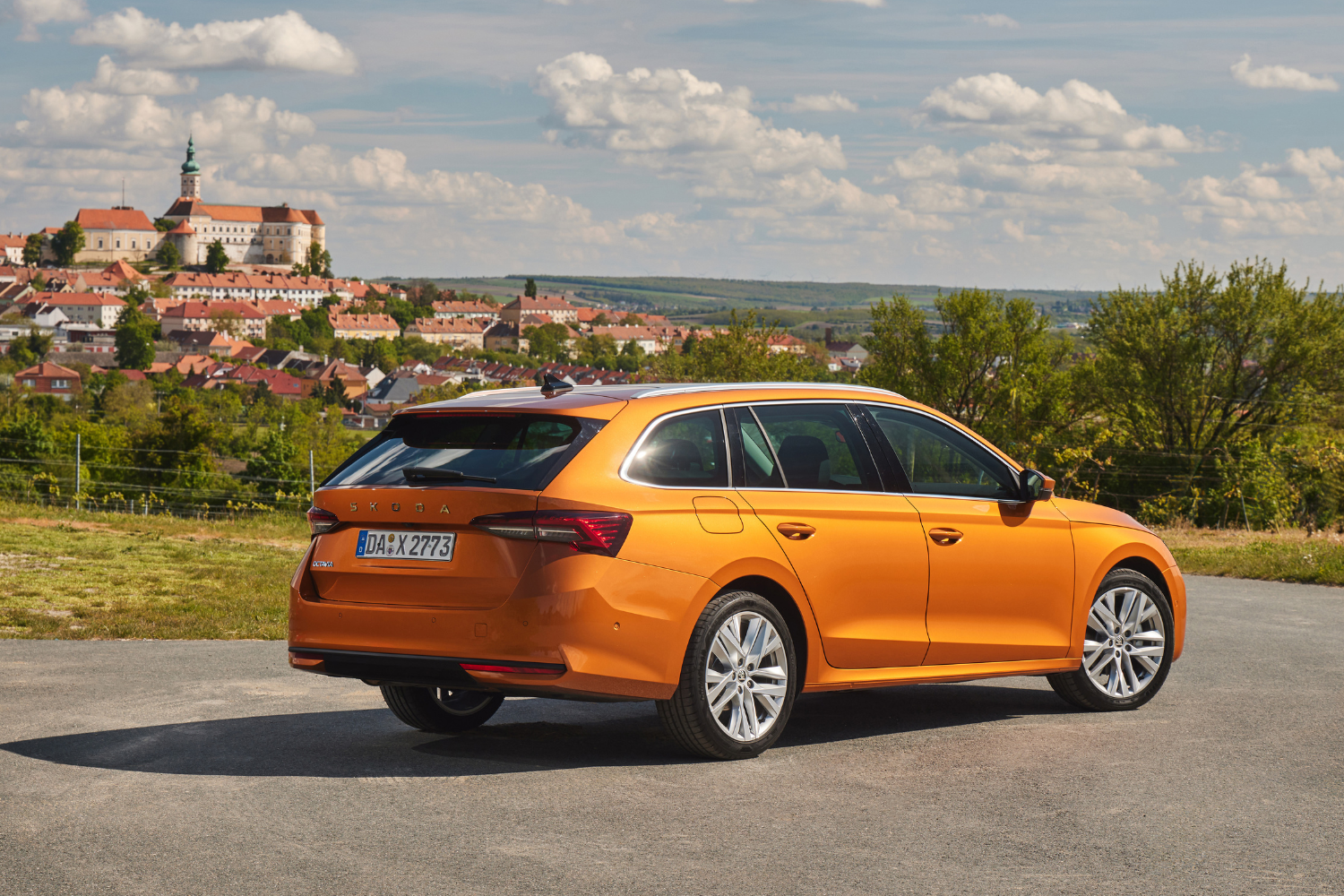 New Skoda Octavia Estate, available in Agnew Skoda Belfast and Agnew Skoda Mallusk, parked in car park with town in background