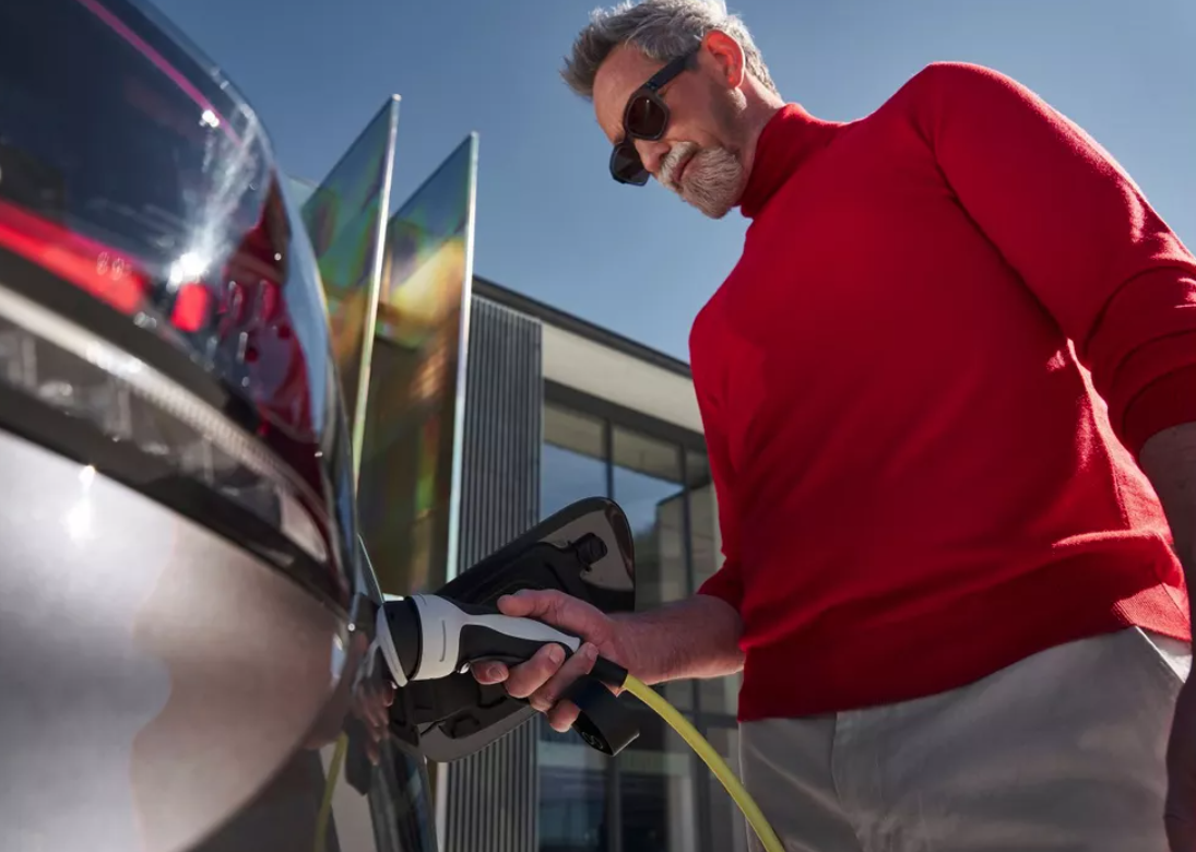 Man charging his electric volkswagen