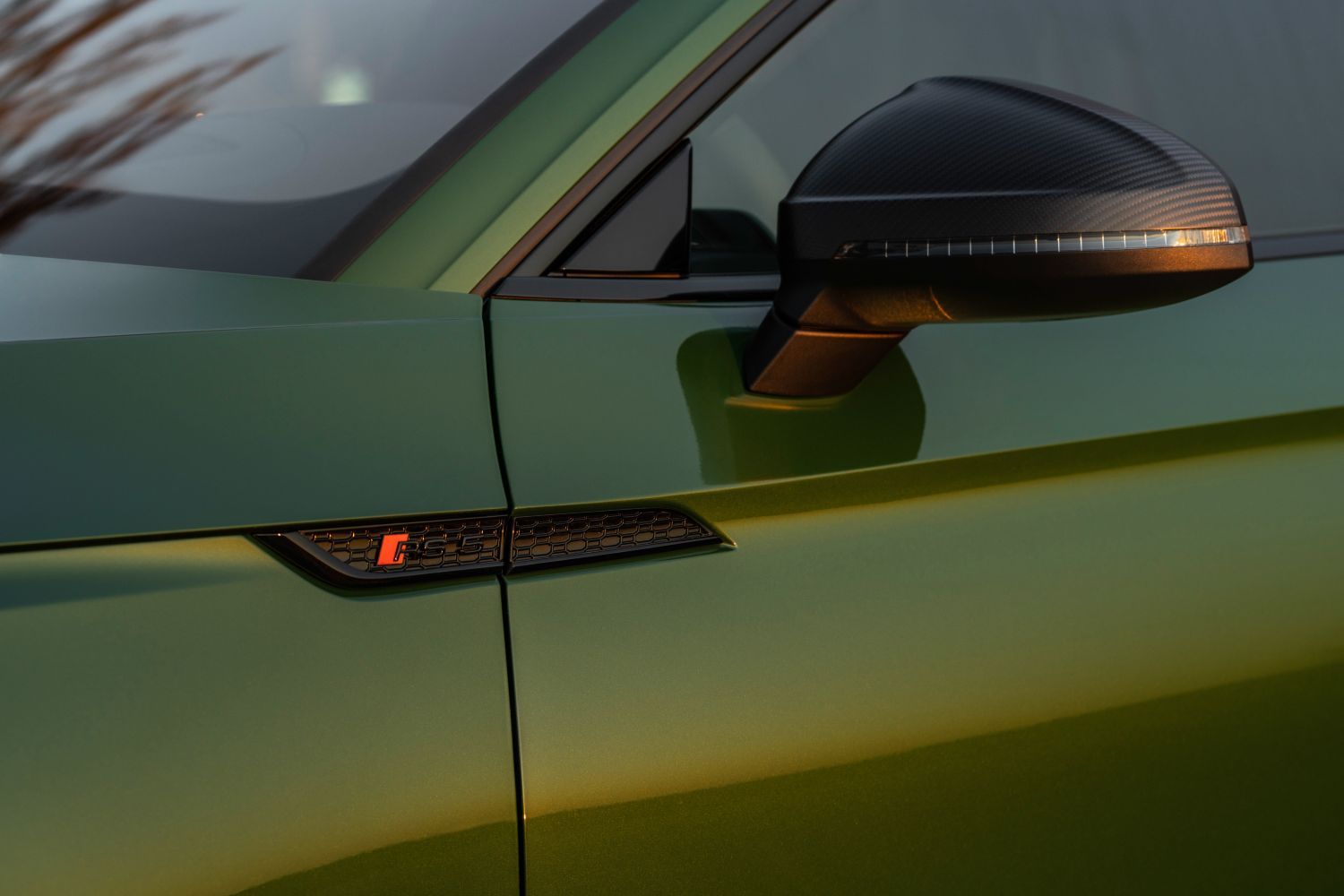 New Audi RS5 Sportback in green with chrome wing mirrors and RS side badge presented