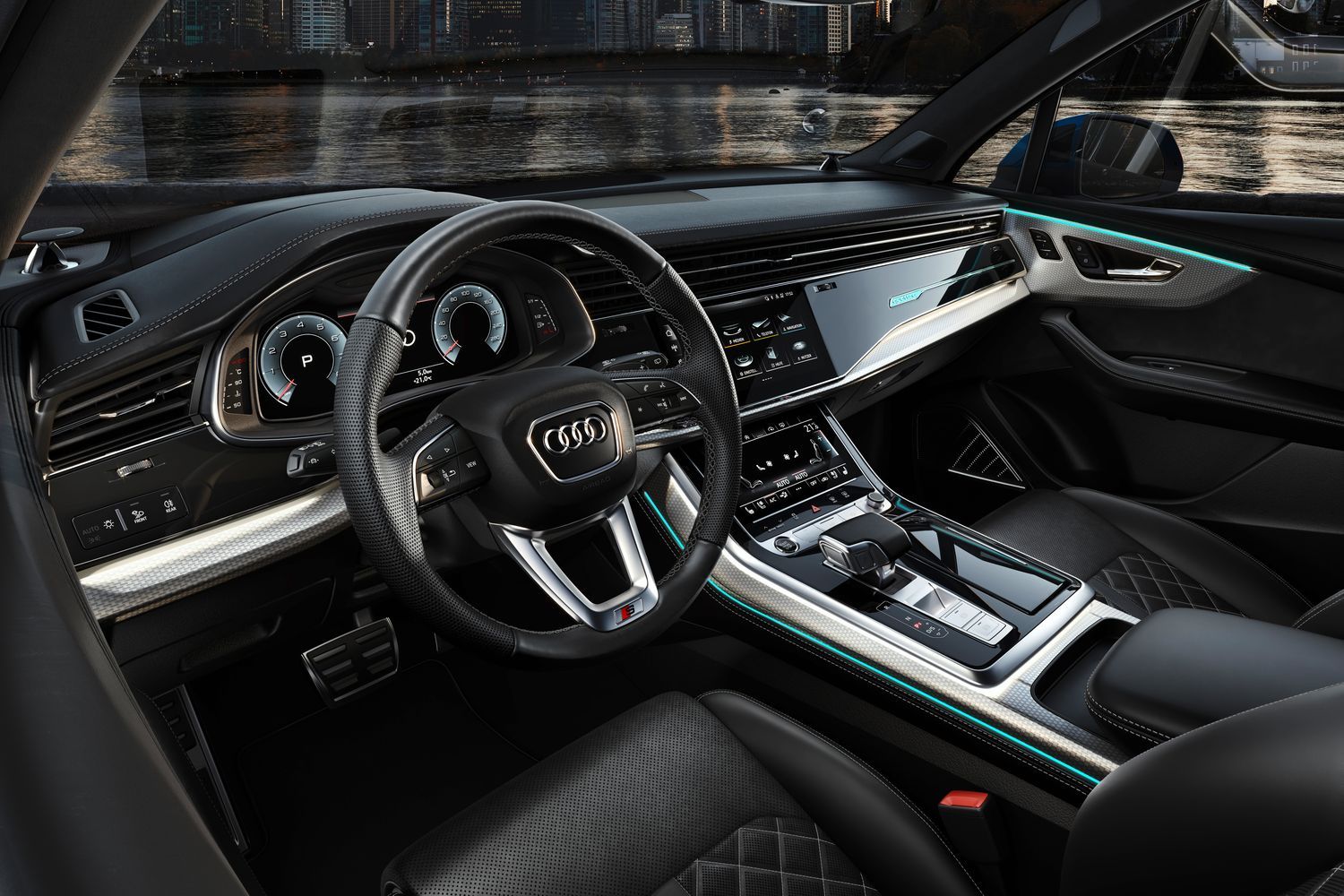 Interior view of the all-new Audi Q7, close-up of steering wheel and infotainment system.