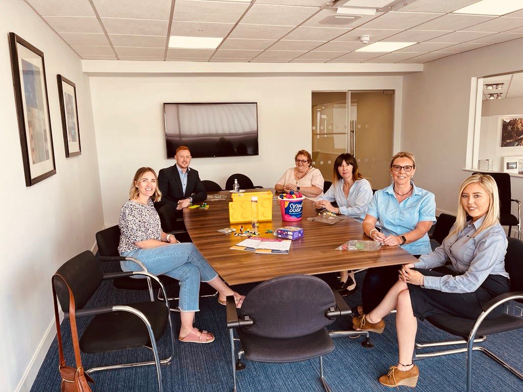 The Agnew Volvo Belfast team play with Lego as they learn more about the Beyond Bricks Programme