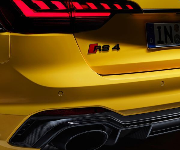 Close up of the rear end of a yellow Audi RS.