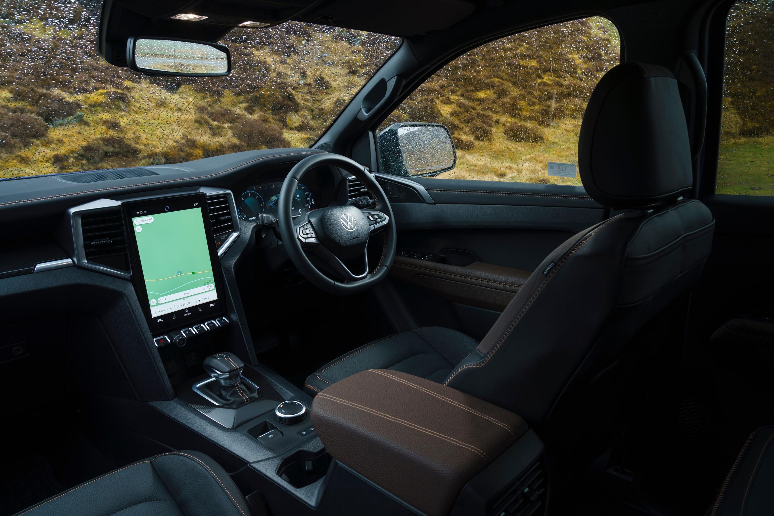 Interior view of the new Volkswagen Amarok, close-up of driver seat, steering wheel and central console.