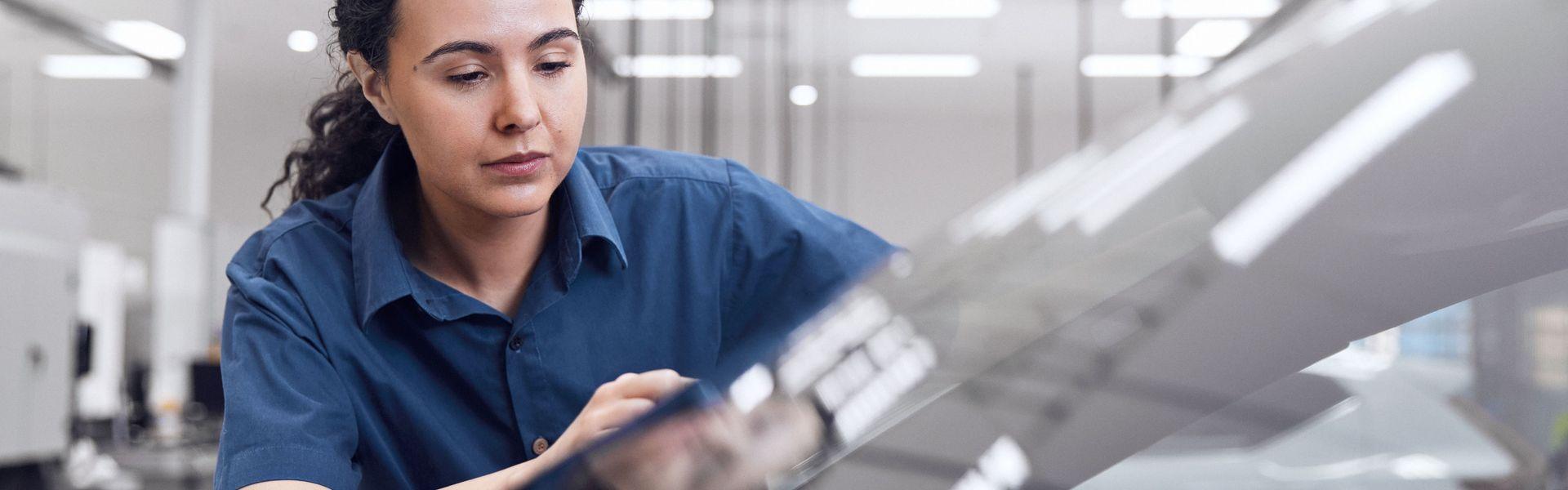 Volvo engineer inspects used Volvo car for windscreen repair