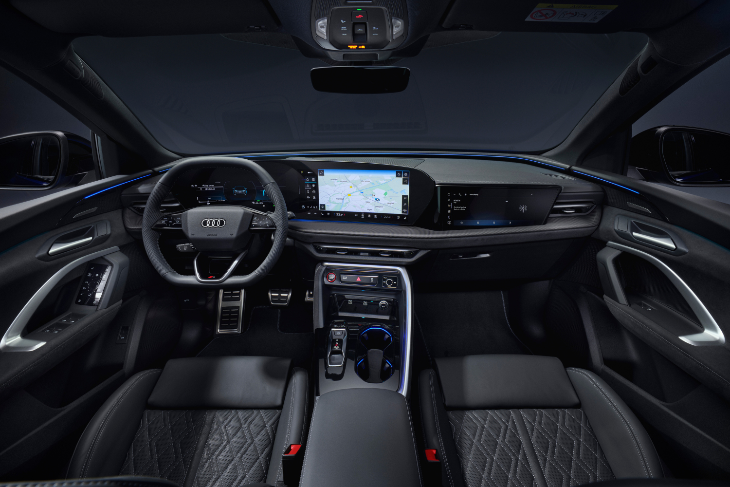 The interior of the new 2024 Audi SQ5 in fine Nappa leather, featuring blue LED lights.