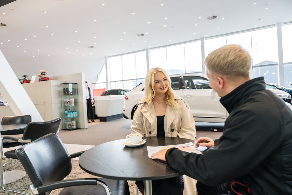 Audi Sales Executive talks to customer about import tax at Portadown Audi