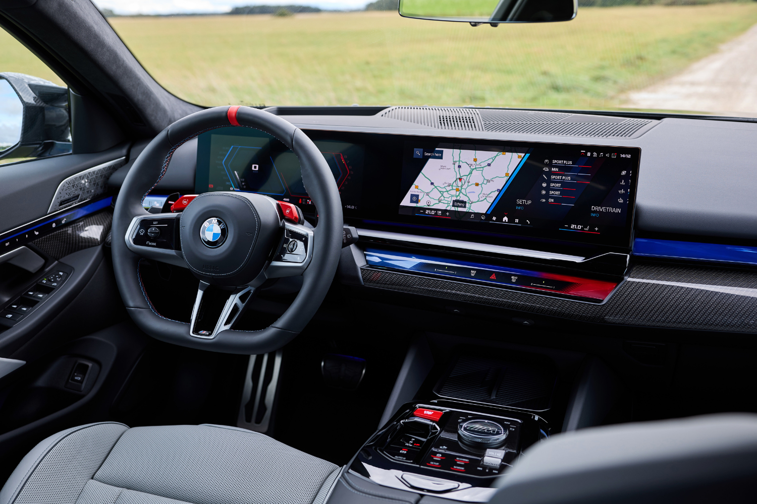 Close up of the new BMW M5 Saloon's black, red and blue interior, featuring a dual driver display.