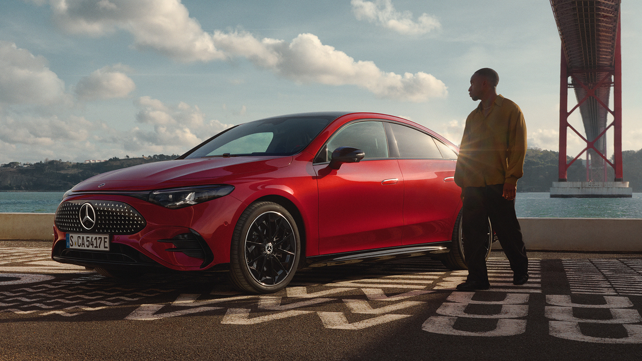 New Mercedes-Benz CLA Electric vehicle parked with person standing beside it