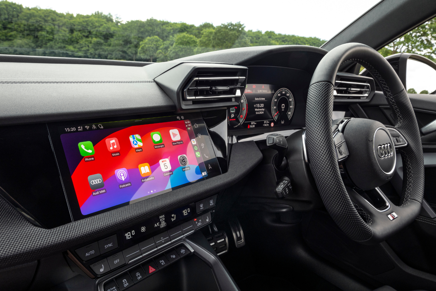 The updated 2024 Audi A3 driver displays and black steering wheel.