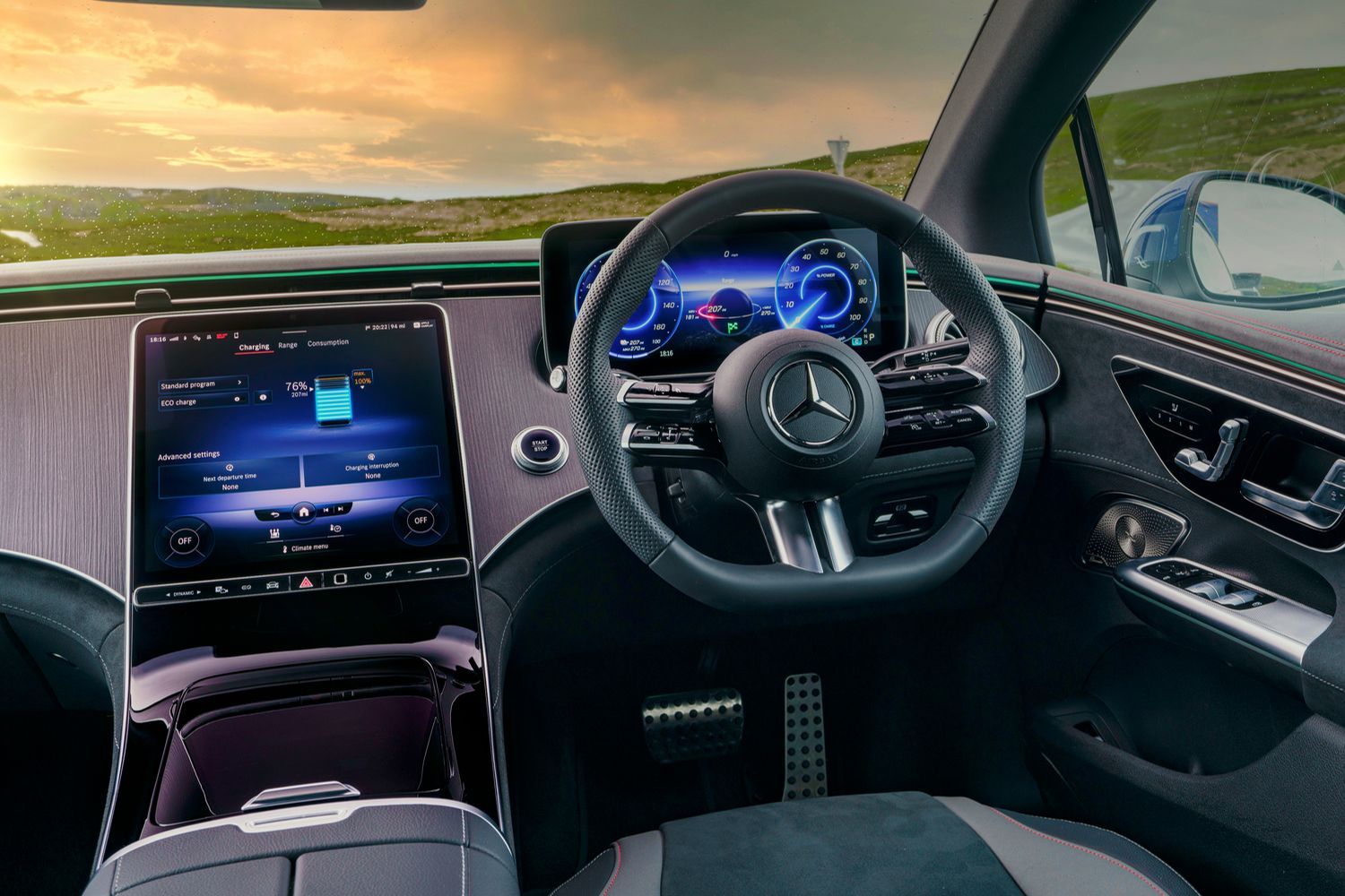Merceces-Benz EQE Saloon steering wheel and dual infotainment displays.
