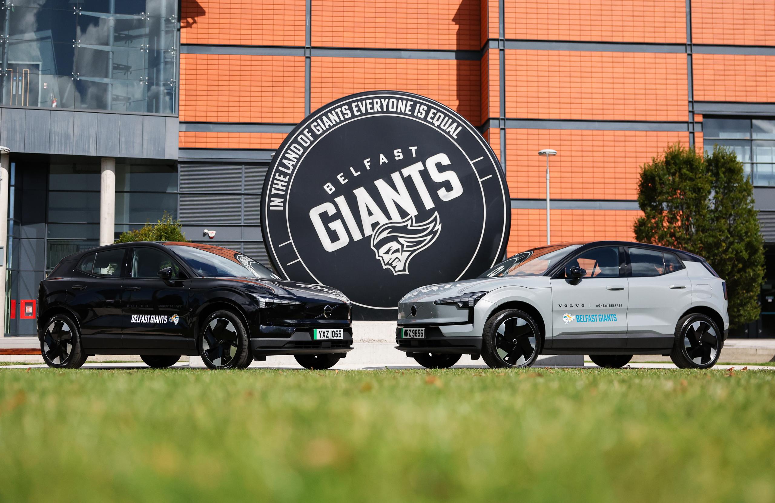 Two volvo vehicles, one black, one silver outside the odyssey sse arena.
