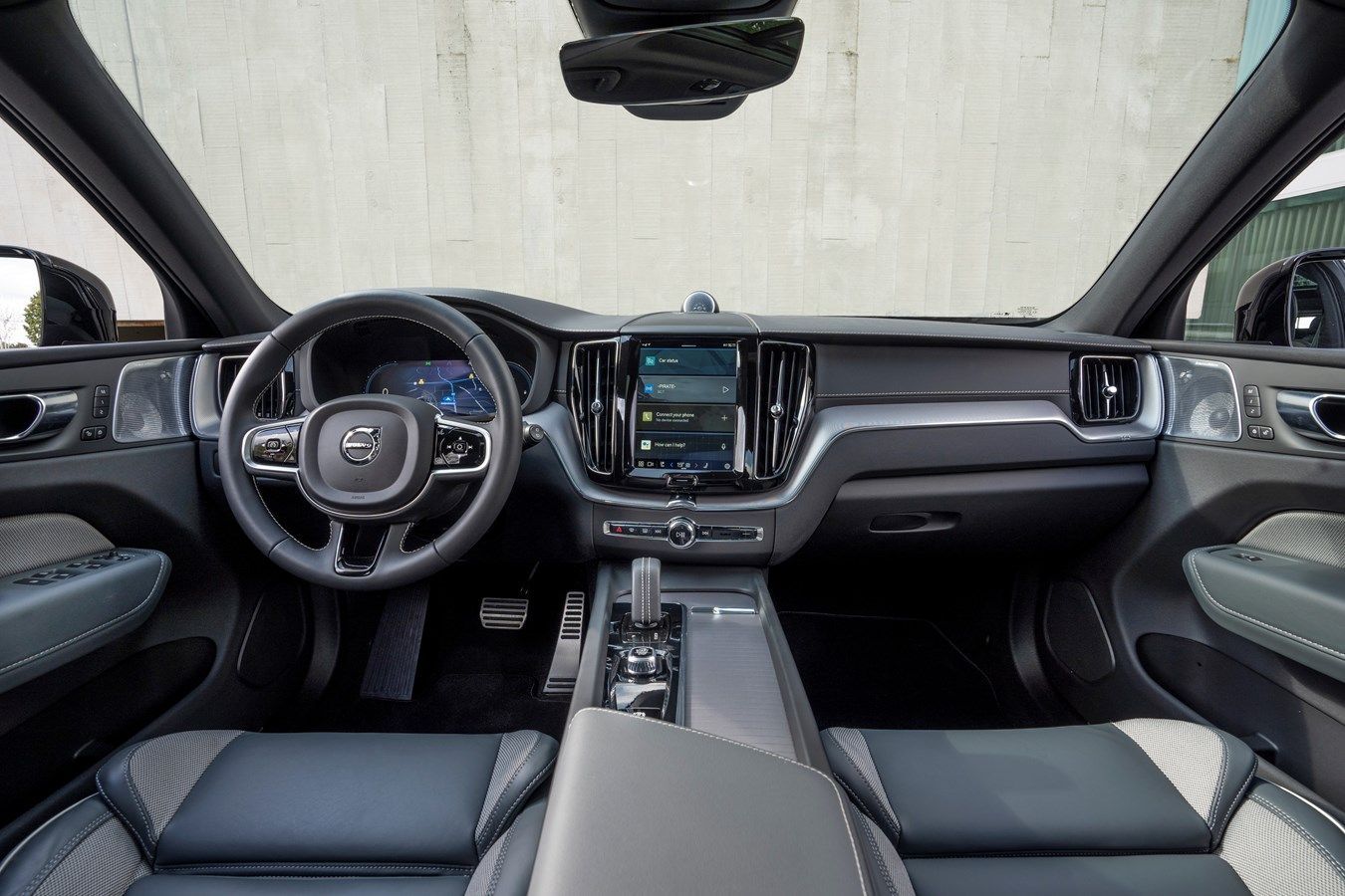 Interior view of the new Volvo XC60, showcasing the steering wheel and infotainment system