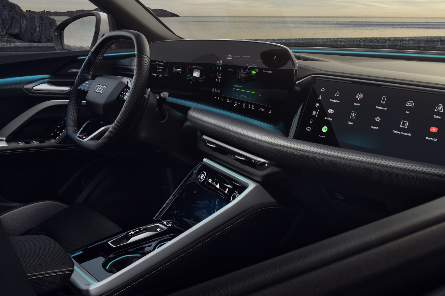 Close up view of the new Audi Q5 SUV e-hybrid's driver display and steering wheel.