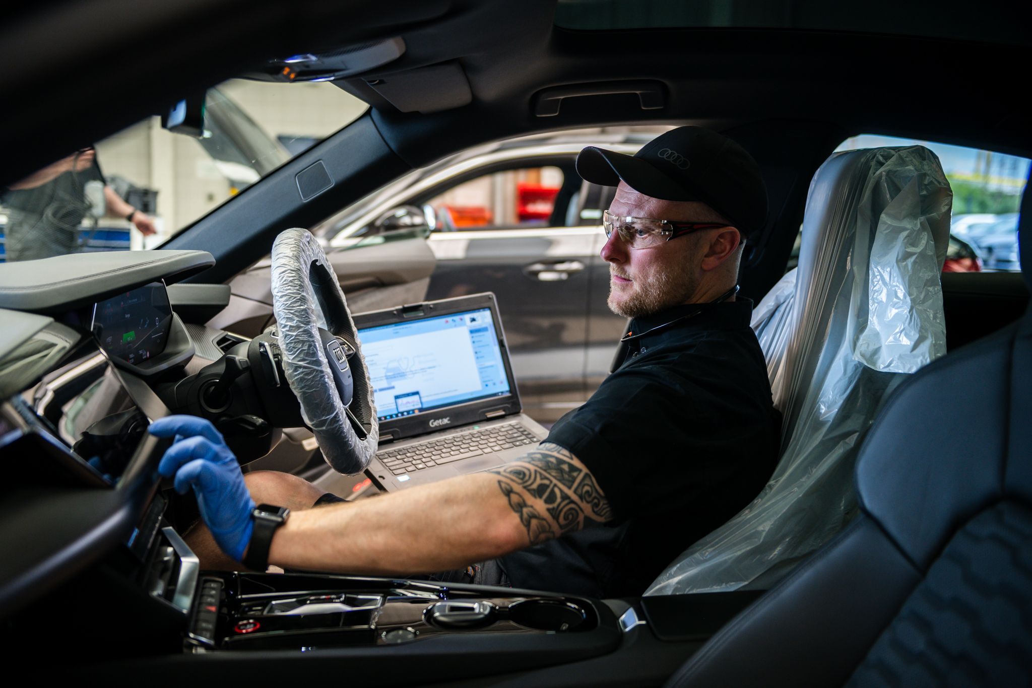 Audi Technician inspects Audi e-tron during service plan at Belfast Audi